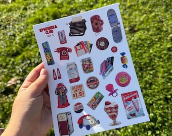 May include: A sheet of vintage-themed stickers featuring retro items like a typewriter, rotary phone, gumball machine, and a milkshake. The sheet includes the text "THE EPHEMERA CLUB Vol. 5" and various brand logos.