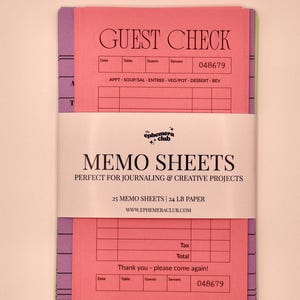 May include: A stack of colorful guest check memo sheets wrapped in a white paper band. The band features the text the ephemera club, MEMO SHEETS, PERFECT FOR JOURNALING & CREATIVE PROJECTS, 25 MEMO SHEETS | 24 LB PAPER, and WWW.EPHEMERACLUB.COM.