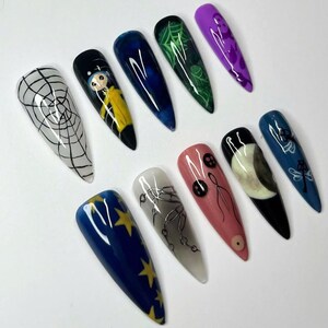 Coraline press on, Gothic nail art, Spooky press nails, Creepy cute nails, Halloween fake nails, Handmade false nails, Horror nail design, Dark aesthetic nails, Unique press on set, Witchy nail art, Long stiletto nails, Movie inspired nails, Alternative nails, Custom nail design, Holiday nails, Party nails