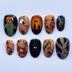 May include: A set of ten Halloween-themed nail art designs. Each nail features a unique design, including a pumpkin-headed figure, a ghost, silhouettes, and autumn leaves. The color palette includes black, orange, brown, and beige.