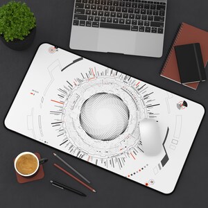 Puede incluir: Una alfombrilla de escritorio rectangular con superficie blanca y un gráfico circular central compuesto por puntos negros y complejas líneas técnicas en negro y rojo. El diseño incluye varios patrones geométricos, marcas radiales y detalles de estilo digital.