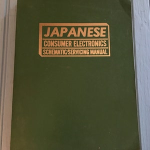 May include: A green book with a gold title that reads "JAPANESE CONSUMER ELECTRONICS SCHEMATIC/SERVICING MANUAL".