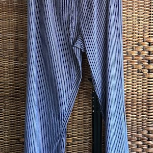May include: Blue and white striped pants with a wide leg and elastic waistband.