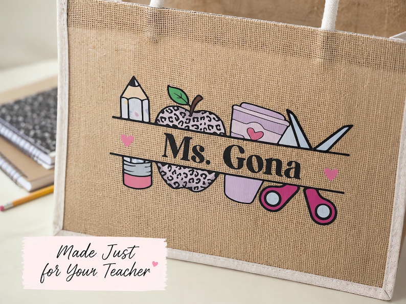May include: A tan jute tote bag with white rope handles featuring a graphic print of a pencil, a leopard print apple, a coffee cup, and scissors. A horizontal banner across the center displays the black text Ms. Gona with small pink hearts.