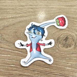 May include: A sticker featuring a cartoon character with a light blue body, blue hair, and a red jacket. The character has a long, curved neck with a red rose at the end. The character is smiling with its arms outstretched.