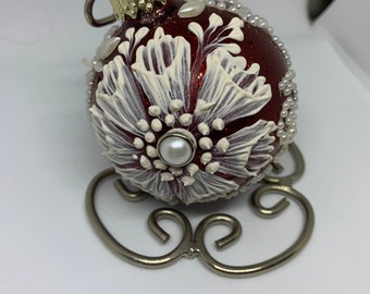 Glass all occasion ornament,’hand mudded when dried 3D effects,pearls around the sides to finish it off, red shinny with sparkles,2.64x2.64