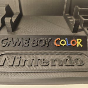 Gameboy stand display with 10 game cartridge display