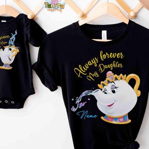 May include: Black t-shirts and baby onesie featuring a cartoon teapot design. The t-shirt reads "Always forever My Daughter" and the onesie says "Always forever My Mom". The teapot has a gold handle and crown.