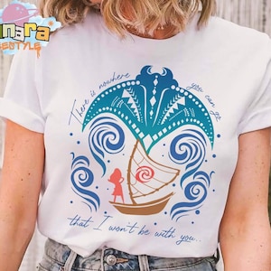 May include: A white short-sleeve t-shirt featuring a graphic of a blue manta ray, a brown sailboat, and a red silhouette of a person. The text reads, There is nowhere you can go that I won't be with you. The design includes blue swirling wave patterns.