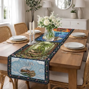 May include: A rectangular table runner with a dragon theme. The runner features four panels with dragon illustrations in various colors, including blue, green, and white. The runner is placed on a wooden table with place settings and a floral centerpiece.