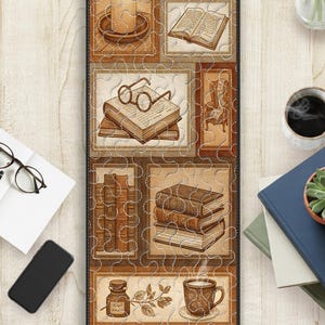 May include: A rectangular, quilted runner featuring a collage of vintage book-themed illustrations in sepia tones. The design includes images of books, a candle, eyeglasses, and a teacup, all framed within a stitched border.