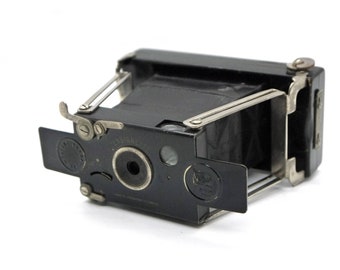 Cámara plegable Houghton Ensignette No.1 de más de 100 años con lente de menisco acromático F11, probada y funcionando