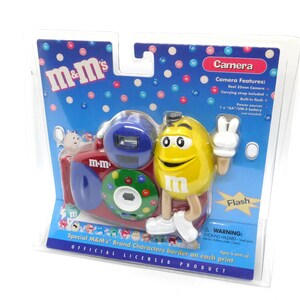 SEALED: M&M’s 35mm compact camera with flash, tested and working