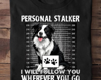 May include: Black t-shirt featuring a black and white Border Collie dog illustration. The shirt has the text "PERSONAL STALKER" above the dog and "I WILL FOLLOW YOU WHEREVER YOU GO BATHROOM INCLUDED" below.