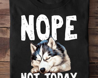 May include: Black t-shirt with the words "NOPE" and "NOT TODAY" in white block letters. A sleeping husky dog with black, white, and gray fur is centered below the word "NOPE".