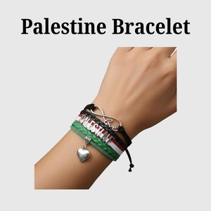 May include: Palestine Bracelet. A multi-strand bracelet featuring the colours of the Palestinian flag: black, white, green, and red. The bracelet includes the word "Palestine" in silver lettering, an infinity symbol with the word "love", and a heart charm.