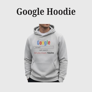 May include: A light gray hoodie with a front pocket and a hood. The front of the hoodie features the Google logo in multiple colors, a search bar with "israel" typed in, and the text "Did you mean: Palestine".