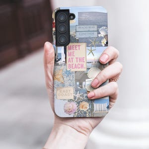 May include: A phone case with a collage of images featuring seashells, starfish, and text that says "Meet me at the beach." The case has a blue, white, and pink color scheme.
