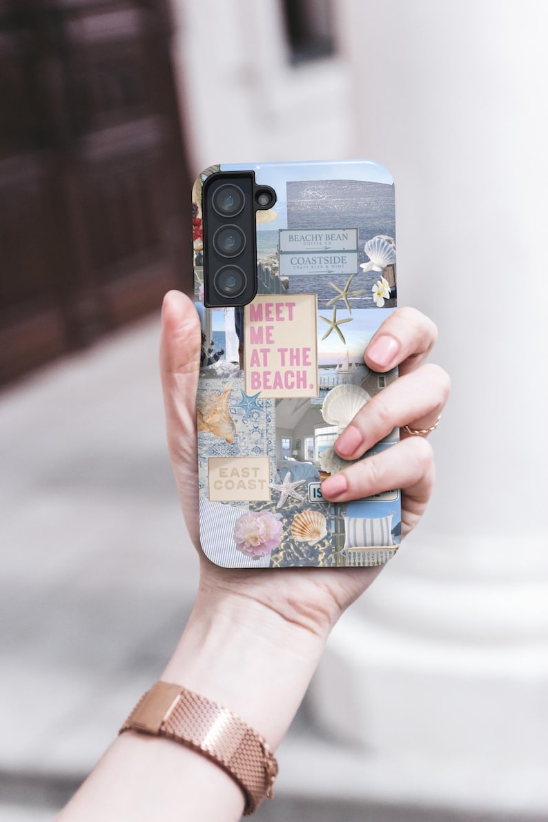 May include: A phone case with a collage of images featuring seashells, starfish, and text that says "Meet me at the beach." The case has a blue, white, and pink color scheme.