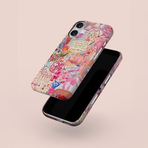 May include: A phone case with a colorful, artistic design featuring pink, red, and white floral elements, handwritten text, and other decorative details. The case is shown with a black phone.