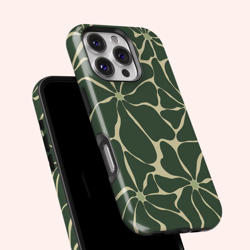 May include: A dark green phone case featuring a repeating floral pattern in a lighter tan colour. The case is shown on top of a black phone. The design is a modern, abstract floral print.