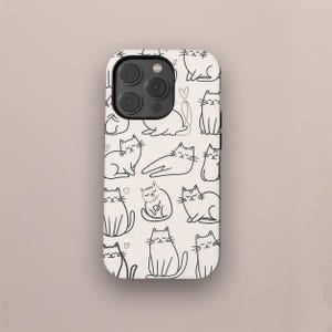 May include: A phone case with a repeating pattern of black line-drawn cats on a cream background. The cats are in various poses, some sitting, some lying down, and some with hearts. The case has a camera bump.