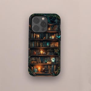 May include: A phone case with a detailed illustration of a bookshelf filled with books, candles, and decorative items. The design includes a raven, a glowing orb, and lush greenery, creating a mystical and enchanting aesthetic. The case has a glossy finish.