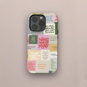 May include: A phone case with a collage design featuring inspirational quotes and phrases in various colours. The case includes text such as "Make yourself a priority," "You are loved no matter how you feel," and "Drink our water."