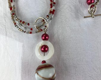 Red and white three strand seed bead pendant necklace