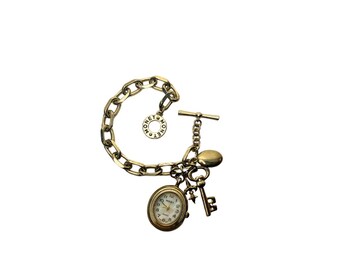 Monet gold-tone charm bracelet watch