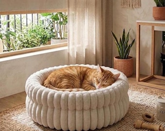 Nido acogedor de felpa para mascotas: cama redonda, cálida y lavable para gatos y perros.