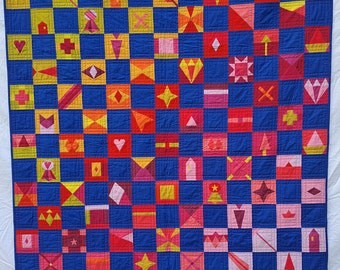 Trapunta per ninnoli dai colori caldi e blu