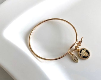 Pulsera West Point: Charm USMA (alambre de memoria dorado)