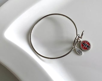 Pulsera de la Guardia Nacional: alambre con memoria en tono plateado con dije