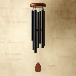 May include: A black wind chime with a wooden top and a teardrop-shaped wooden clapper. The chime has multiple black tubes of varying lengths suspended from a circular wooden top. The clapper hangs from a black string.