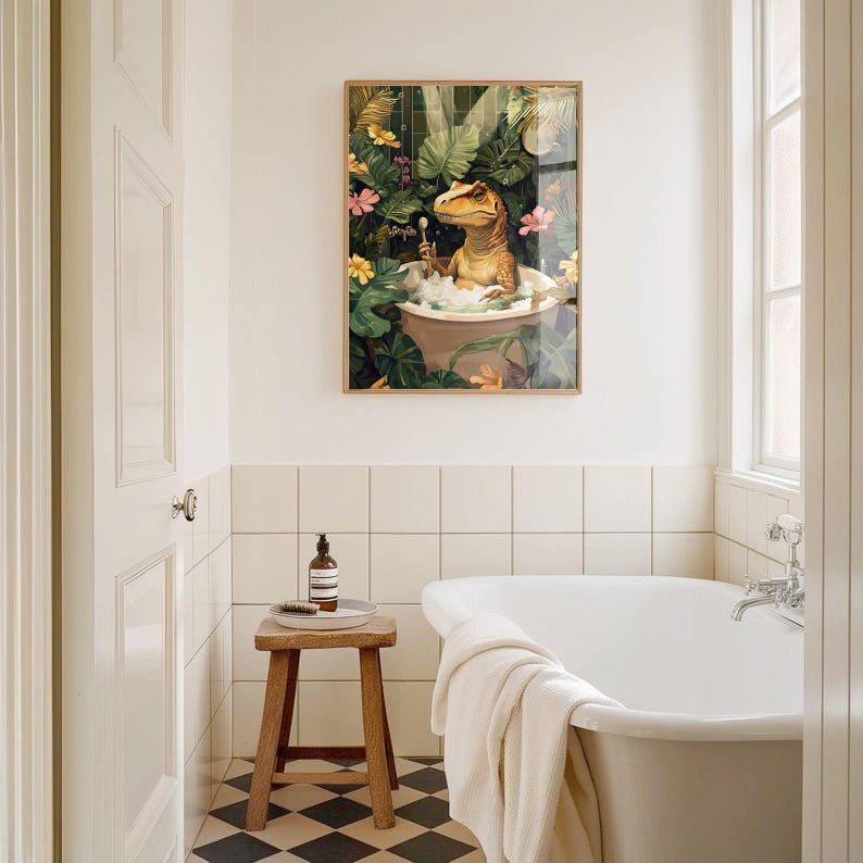 May include: A framed art print depicts a dinosaur relaxing in a bathtub filled with bubbles. The artwork features a lush jungle background with colorful flowers and foliage. The dinosaur is light brown and the bathtub is a light beige color.