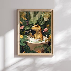 May include: A framed art print depicts a dinosaur relaxing in a bathtub filled with bubbles. The dinosaur, with yellow and brown scales, holds a spoon. Lush green foliage and pink and yellow flowers surround the tub, creating a tropical scene.