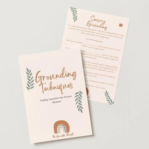 May include: Two cream-colored cards with text and illustrations. One card reads "Grounding Techniques" with a rainbow graphic. The other card is titled "Sensory Grounding." Both cards have green leaf illustrations.