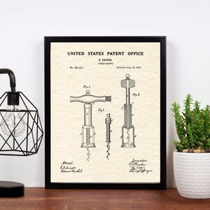 May include: A vintage patent drawing for a corkscrew, framed in black, with the title "United States Patent Office" and the patent number "181,145".