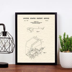 May include: A black and white patent drawing for a computer mouse. The drawing shows the mouse in different views, with labels for each part. The patent number is 4,064,412 and the date is Aug. 7, 1978. The title of the patent is "Cursor Control Device for Use With Display Systems".