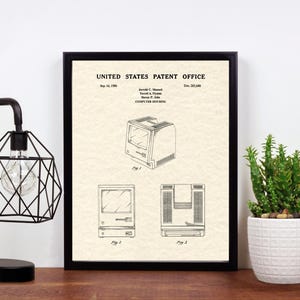 May include: A black and white patent drawing of a computer housing. The drawing shows the front, side, and top views of the computer. The patent number is 4,513,488 and the date is Sep. 10, 1985.