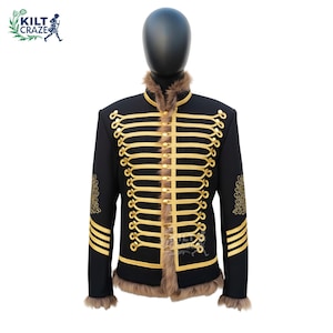 May include: Black military-style jacket with gold trim and fur collar and cuffs. The jacket features multiple rows of gold braid and decorative gold embroidery on the sleeves. The jacket is displayed on a black mannequin.