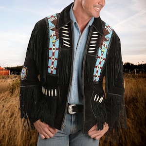 May include: A black suede jacket with fringe and beaded designs. The jacket features two eagle motifs and a geometric pattern in blue, red, and white.