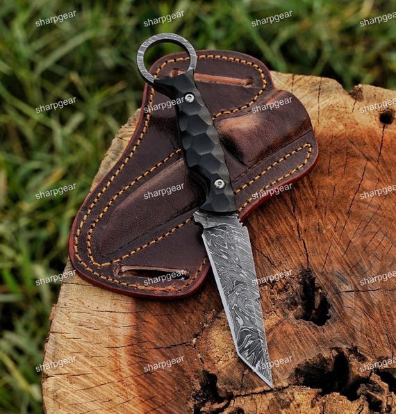Damascus Tanto with custom engraving and 242 favorites — the pattern-welded layered steel gives it a genuinely striking visual that photos translate well.