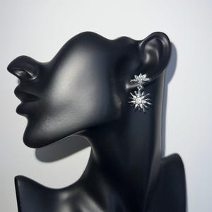 Earrings with star charm in silver