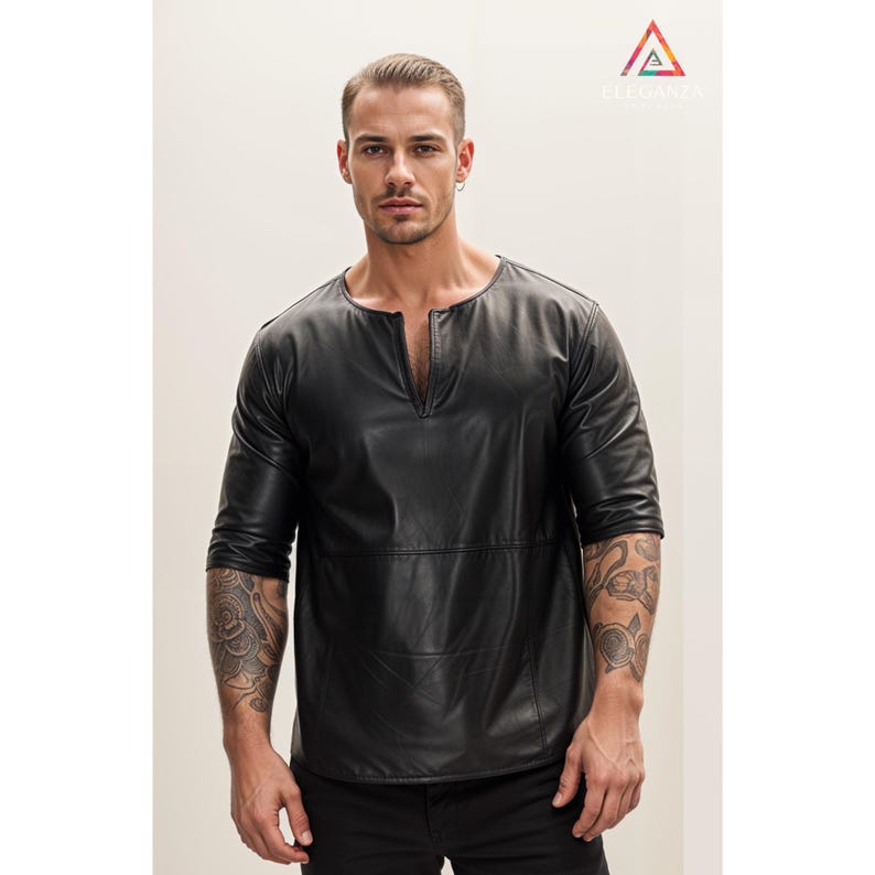 May include: A black leather shirt with a V-neck and three-quarter sleeves.