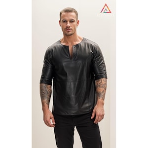 May include: A black leather shirt with a V-neck and three-quarter sleeves.