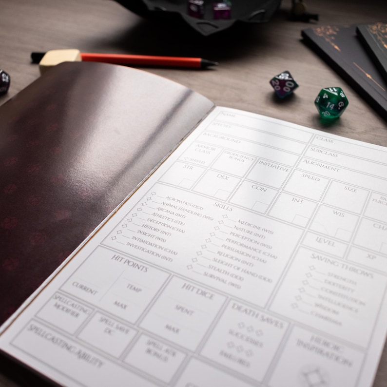 an open notebook with a detailed character sheet or inventory list, along with a pen and a pair of dice on a wooden surface.
