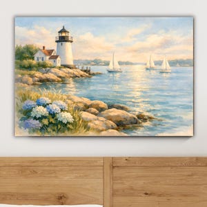 Bring the timeless beauty of New England’s coastline into your home with this ready-to-hang coastal lighthouse canvas wall art. This serene watercolor scene features a classic white lighthouse overlooking a peaceful harbor, sailboats gliding across sunlit water, rocky shoreline, and soft coastal greenery.The soft watercolor style and tranquil coastal palette make it ideal for beach houses, coastal cottages, Cape Cod or Nantucket-inspired homes, lake houses, and vacation rentals.