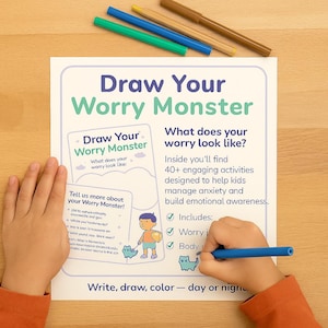 May include: A child's hands are shown drawing on a white paper with the title "Draw Your Worry Monster". The paper includes text and illustrations, with colored markers in the background. The text encourages kids to manage anxiety.